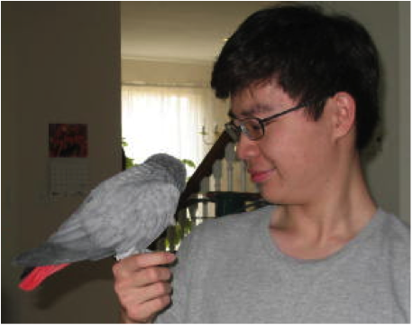 a photo of the author hodling a bird.