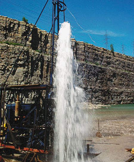A photograph of a Flowing artesian well