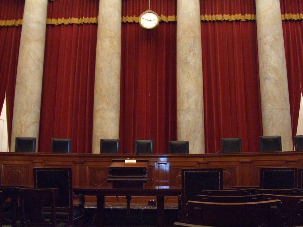 Inside view of eight of the nine Supreme Court justices’ chairs is shown.