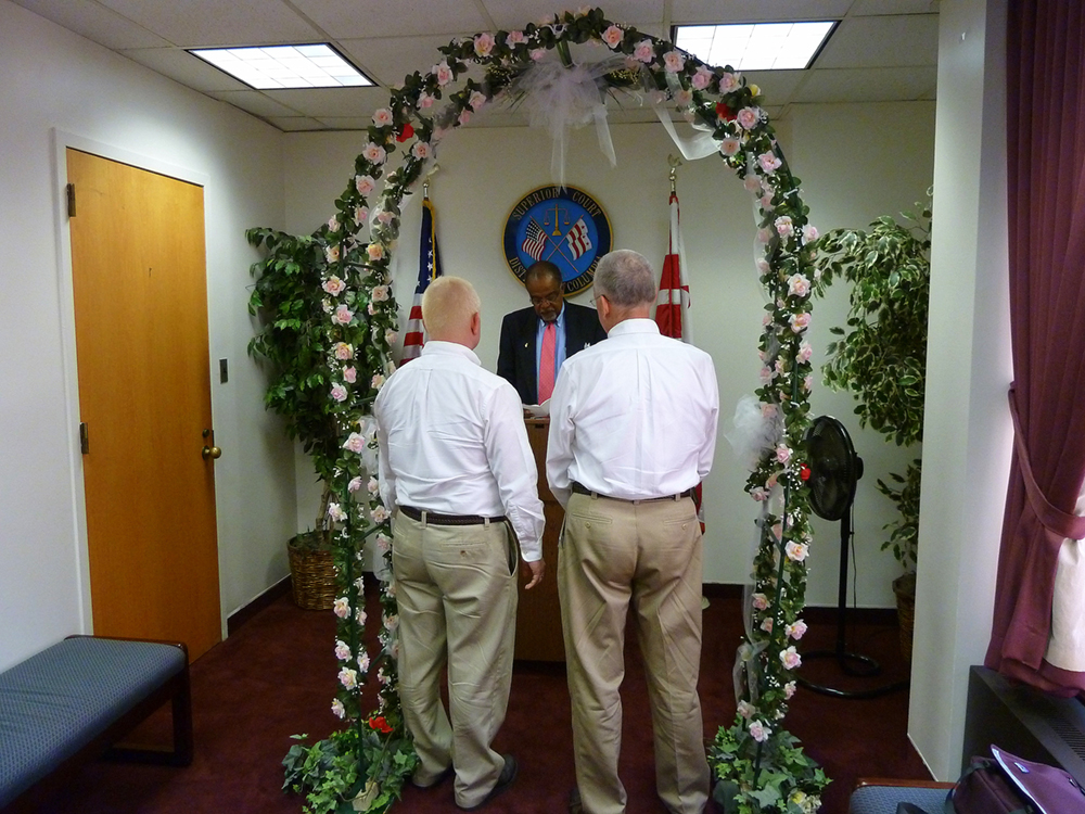 Two men at a marriage altar are shown here.