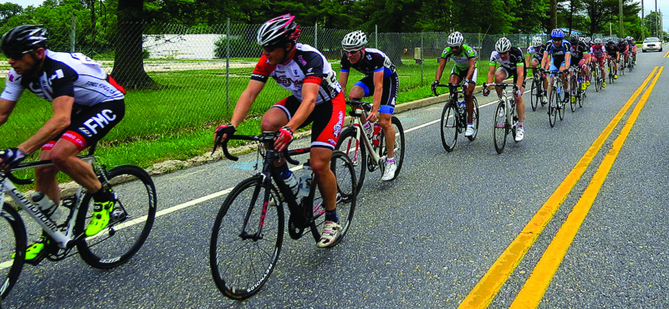This photo shows a pack of cyclists in a road race.